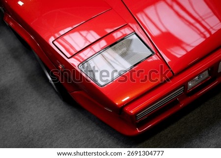 a close up of a red supercar 