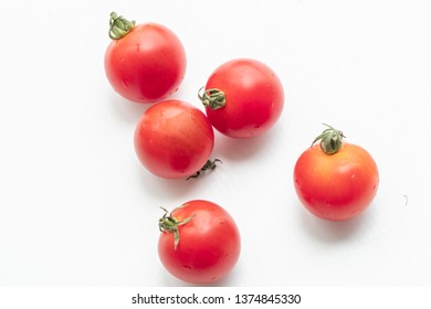Close up red tomatoes on isolate white background.Selective focus red tomatoes.