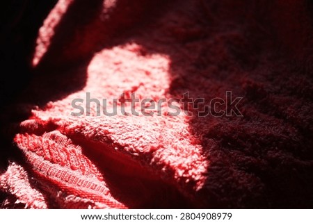 Close Up Red Towel Surface Texture Under Sunlight with Soft Textile Weave Detail Macro Shot HD