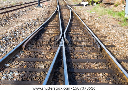 Close up of redirection old train or railroad tracks with wooden backing In the countryside Thailand
