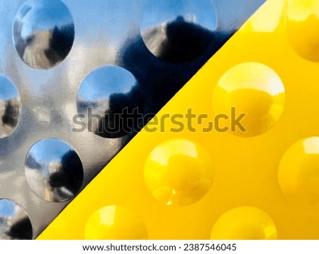 Close up Reflection of traffic signal pole black and yellow contrasting