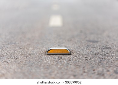  Close Up Of Reflector On  Asphalt Road 