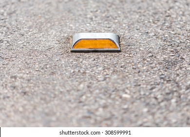  Close Up Of Reflector On  Asphalt Road 