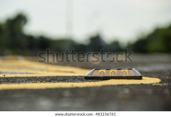 Close up\
Reflector Solar Road Stud on\
asphalt