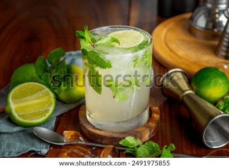 Close up refreshing classic mojito on the table 