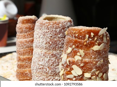 Close up retail display with ready to eat sweet Trdelnik, this spit cake is popular in Europe, Austria, Hungary, Slovakia and Czech, especially in Prague