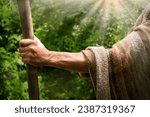 Close up retro rustic tool medieval rural herd devote adult age wise herder worker saint prayer John baptist. Middle east holy jew Joseph robe cloth walk Lord pray hope bible story rod symbol concept
