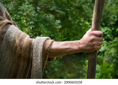 Close up retro rustic tool medieval rural herd devote adult age wise herder worker saint prayer John baptist. Middle east holy jew Joseph robe cloth walk Lord pray hope bible story rod symbol concept