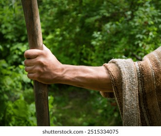 Close up retro rustic tool medieval rural herd devote adult age wise herder worker saint prayer John baptist. Middle east holy jew Joseph robe cloth walk Lord pray hope bible story rod symbol concept