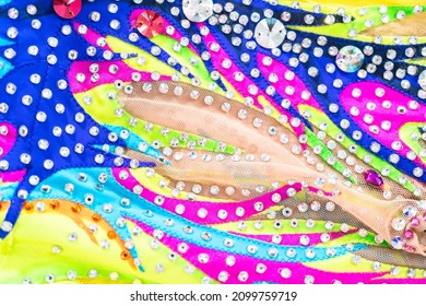 Close Up Of Rhinestones And Colorful Fabric On Figure Skating Dress.