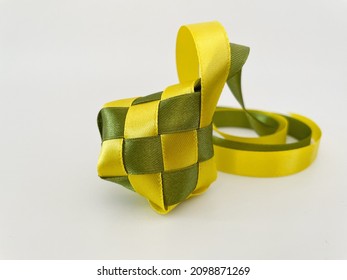 Close Up Of Ribbon Ketupat On White Background. Hari Raya Concept