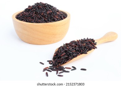 Close up of riceberry rice in wooden spoon and background is riceberry rice in wooden bowl on white background. - Powered by Shutterstock