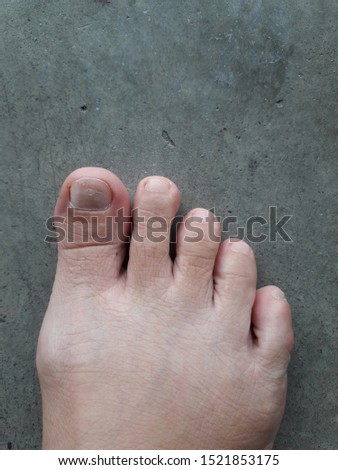Close up right barefoot on cement floor