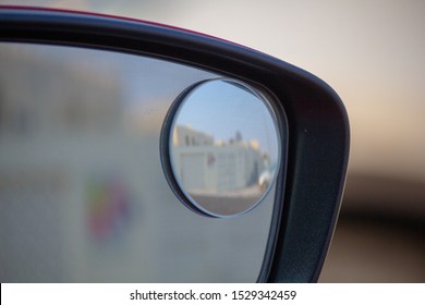 Close up of right blind spot car side mirror