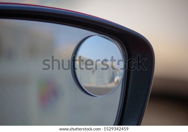Close up of right\
blind spot car side\
mirror