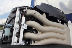 Close Up Right Side Of Four Stroke Injectort Outboard Motor With Open Hood Against The Sky And Boat Awning, Outdoor Repair And Maintenance Of Water Equipment