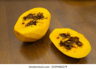 close up of ripe mango slices that are rotten and damaged due to being bitten by insects and caterpillars. - Powered by Shutterstock