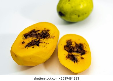 close up of ripe mango slices that are rotten and damaged due to being bitten by insects and caterpillars. - Powered by Shutterstock