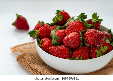 Close Up Of Ripe Red Strawberries On White Bowl