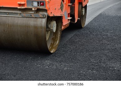 Close up road rollers compacting  asphalt - Shutterstock ID 757000186