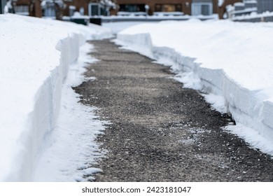 Close up of road with salt for melting snow in winter near houses. - Powered by Shutterstock