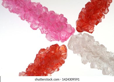 Close Up Rock Candy Pink Red And Clear On White Background