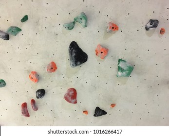 Close Up Of Rock Climbing Holds On A Wall.