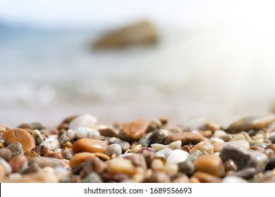 Close up rock sand with blur tropical beach and blue sky abstract background. Copy space of summer vacation and product display in nature. Vintage tone filter effect color style.