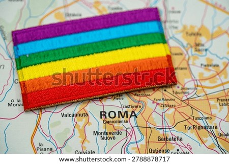 Close up of Rome map with rainbow pride flag.
