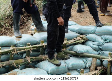 Close Up Of A Rope Bamboo  Structure And Sandbag. For Security In Constructing Small  Water Reservoir Of The People Of Northern Thailand.