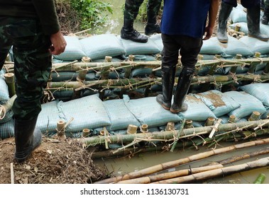 Close Up Of A Rope Bamboo  Structure And Sandbag. For Security In Constructing Small  Water Reservoir Of The People Of Northern Thailand.