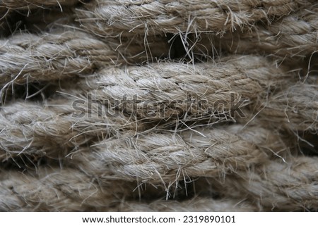 A close up of the rope shows the details of the tiny fibers strung together to form a large rope.
