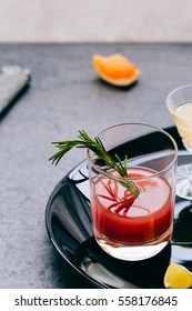 Close Up Of Rosemary In Glass Of Cranberry Juice