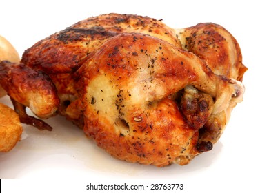 Close Up Rotisserie Chicken Over White Background.