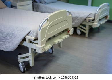 Close Up Of Row Of Empty Hospital Beds 