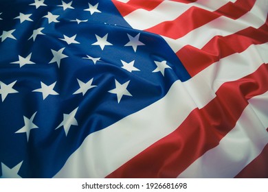 Close up of ruffled American flag. Satin texture curved flag of USA. Memorial Day or 4th of July. Banner, freedom concept - Shutterstock ID 1926681698