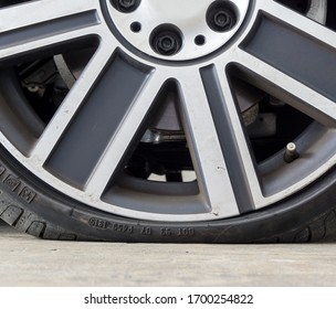 Close Up Of Run Flat Tires While There Is Air Tire Pressure Lose In Driving On Street Background.