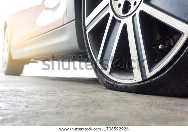 Close up of Run flat\
tires While there is air tire pressure lose in driving on street\
background.	
