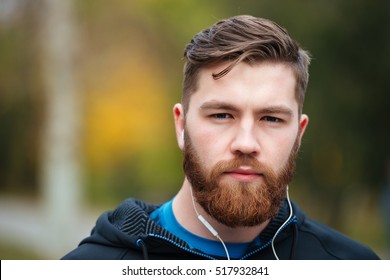 Close up runner in park looking at camera