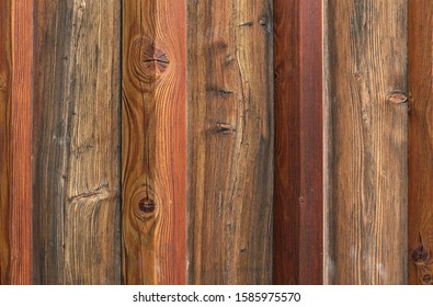 Close Up Rustic Dark Brown, Gray, Black And Red Barn Wood Texture (grunge House Wall).  Natural Outdoor Wooden Facade And Cladding.