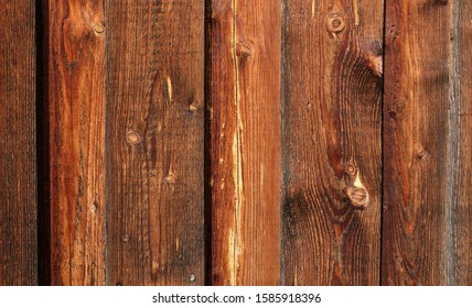 Close Up Rustic Dark Brown Red Barn Wood Texture And Background. Natural Outdoor Wooden Facade And Cladding.