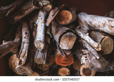 Close up of rustic stack of firewood, wooden texture 