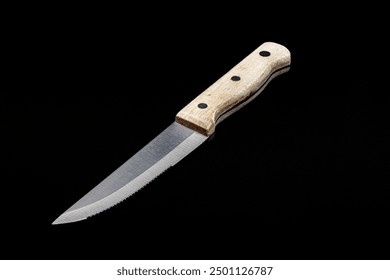 Close up of Rustic Wooden Handle Meat Cutting Knife on Black Background - Powered by Shutterstock