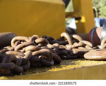 Close up of rusty chains on a machine 
