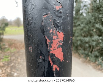 a close up of a rusty lamp post