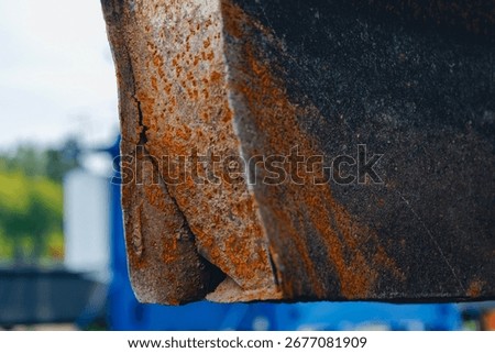 Close up of rusty metal surface of ship hull after collision and run aground in industrial shipyard port, repair and maintenance concept.