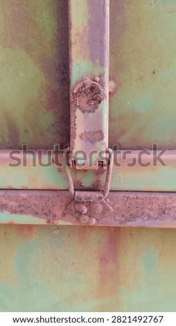 Close Up of Rusty Metal Toggle Latch on Industrial Steel Door