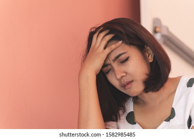 Close Up Sad Asia Woman Sitting At Stairwell Fire Escape.Depression And Problem Concept.