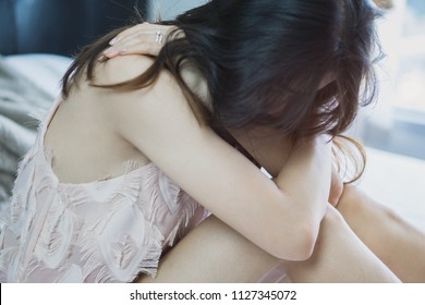 Close up of a Sad lonely woman sitting with loneliness thinking to something with sadness.soft and selective focus. Love and wedding co - Powered by Shutterstock