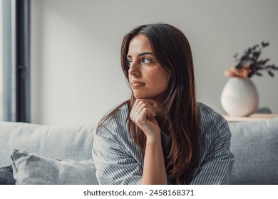 Close up of sad pensive millennial woman sit alone thinking about relationships personal problems, upset thoughtful young female lost in thoughts feel lonely depressed pondering or mourning at home - Powered by Shutterstock